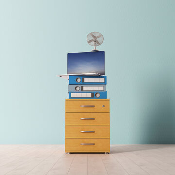 Stacked office supplies on yellow cabinet symbolizing balance and teamwork