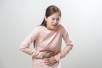 Flatulence asian young woman intolerance hand in stomach ache, suffer from food poisoning,...
