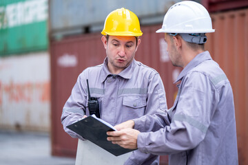 Safety briefing for warehouse workers shipping yard professional training industrial setting close-up teamwork focus