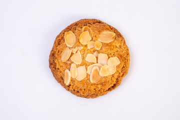 Traditional almond cookies with almond flakes on white background. Image on top view.