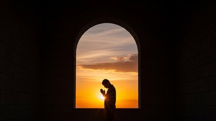 Silhouette of a Person Praying in an Archway at Sunset, Spiritual Moment.