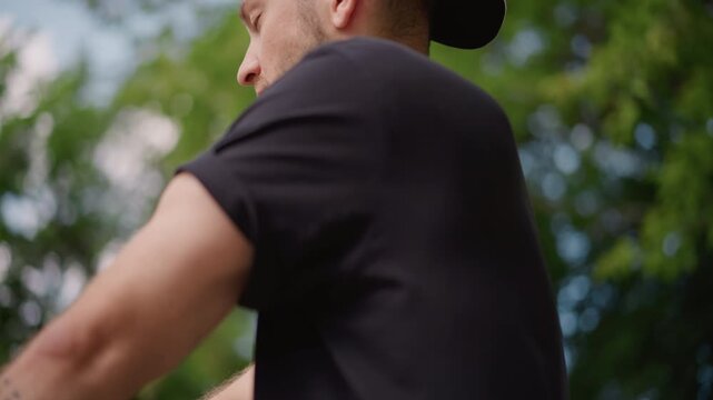 Man Under Trees, Relaxed Individual Observing Greenery Nearby, Serene Person Wearing Cap Admiring Nature Scenery, Tranquil Man In Casual Attire Gazing Thoughtfully Amidst Lush Leafy Surroundings