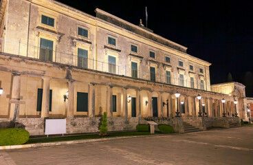 The Palace of St. Michael and St. George in Corfu illuminated at night. Neoclassical architecture, stone columns, Greece