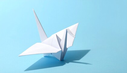 White origami paper crane on solid blue background, minimalist style, clean sharp folds, soft studio lighting, modern aesthetic, high contrast, centered composition