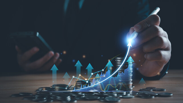 Business, finance and investment concept. Business man analyzing and calculating tax, financial data with economic graph growth chart, strategy and budget planning, digital banking and market. banner. - Powered by Adobe