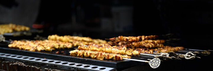 Closeup of Chicken kebab skewers on BBQ