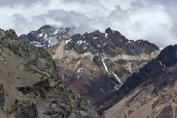 The enchanting beauty of the snowy mountains. The view of snow and rocks on the mountain tops.