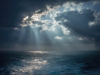 Dramatic sunbeams pierce stormy clouds over a turbulent ocean