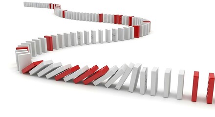 Dominoes Falling in a Curved Line.