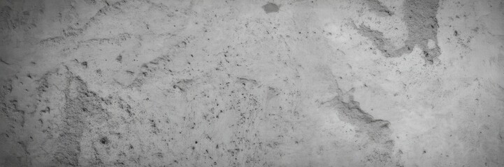 Fototapeta premium Close up of a textured white surface with dark speckles and faint markings