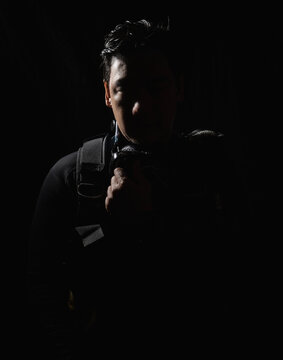 Half lit portrait of diver in Thailand