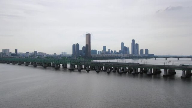 Seoul's Han River Railway Bridge aerial shot, trains and trains pass by.
