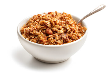 Healthy granola bowl with nuts and dried fruits placed on a white background at a breakfast setting