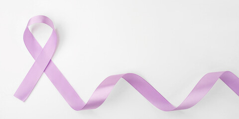 Lilac ribbon on white background. World Cancer Day on February 4.