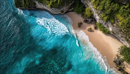 Turquoise ocean waves meet a tropical beach at the base of lush green cliffs
