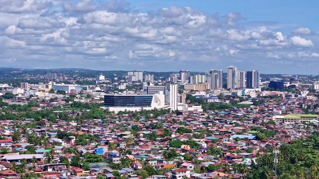 Davao City Mindanao Philippines. Rising aerial high above the city showcasing downtown Davao and the surrounding areas.