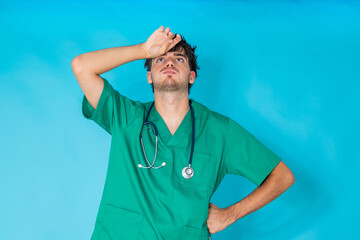 young doctor isolated on background with a tired or stressed expression