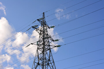 Electricity Pylon and Power Lines Against a Blue Sky copy space