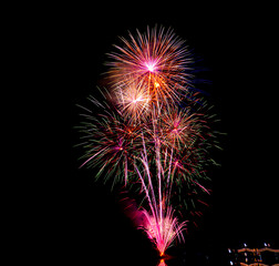 Colorful fireworks exploding in the night sky, symbolizing celebration, festival opening ceremony, New Year celebration, success, joy, and special events.