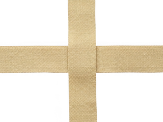 Cross shape made from textured beige burlap ribbon material isolated on transparent background for craft or decoration design element