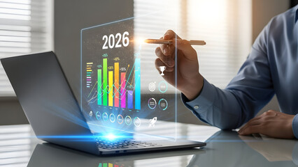 Businessman analyzing 2026 market trends on futuristic laptop screen