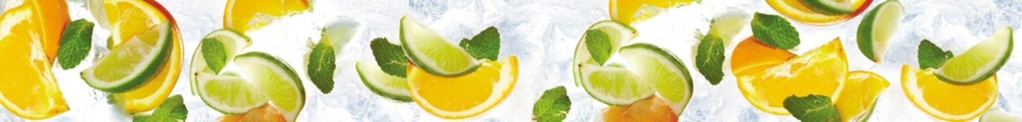Fresh citrus background with orange and lime slices mixed with mint leaves and crushed ice texture © MonTeArt