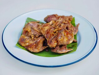 Frield field rats are placed on a plate. They look very appetizing and delicious. Thai food.