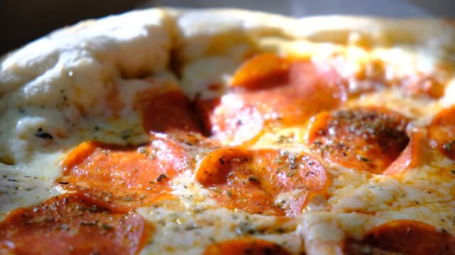 Tasty hot pepperoni pizza. Hot Spicy Pizza with chilli pepper, salami, mozzarella cheese and tomato ketchup,  restaurant food. Sunlight