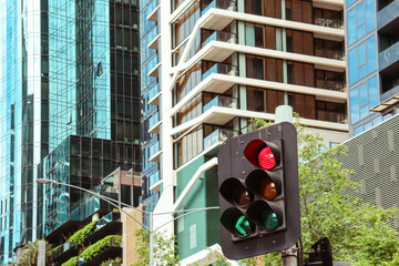 traffic light in the city with skyscrapers