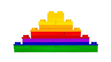 Naklejka premium Colorful plastic building blocks stacked in pyramid shape featuring green blue purple red orange and yellow layers symbolizing creativity and playful learning for children