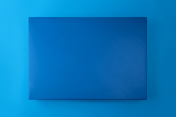 Top view of blue color box on blue background
