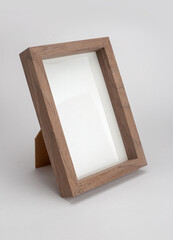Wooden desktop photo frame modern style, picture frame on white background.