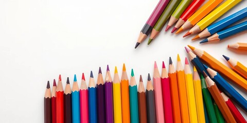 Fototapeta premium Vibrant colored pencils arranged artfully on white background, eraser, art materials