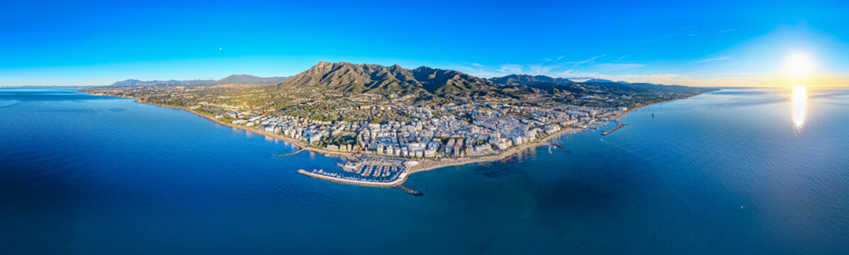 Luxury Living at Dawn: Cinematic 4K Aerial of Marbella&rsquo;s Golden Mile, Featuring Exclusive Beachfront Resorts, the Paseo Mar&iacute;timo, and La Concha Mountain, Costa del Sol, Spain