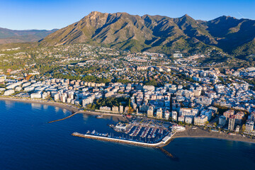 Luxury Living at Dawn: Cinematic 4K Aerial of Marbella&rsquo;s Golden Mile, Featuring Exclusive Beachfront Resorts, the Paseo Mar&iacute;timo, and La Concha Mountain, Costa del Sol, Spain