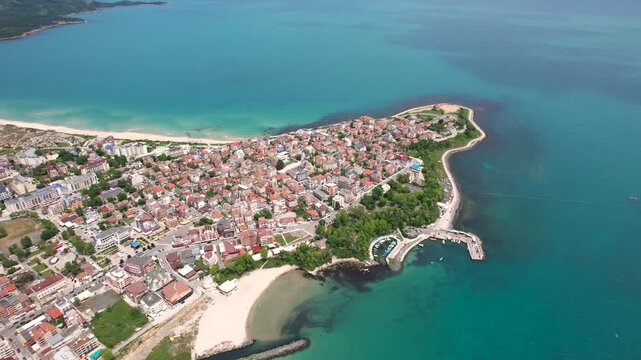 Aerial view of the town of Primorsko, a coastal gem where terracotta roofs meet the turquoise waters of the Black Sea, Primorsko, Burgas, Bulgaria.