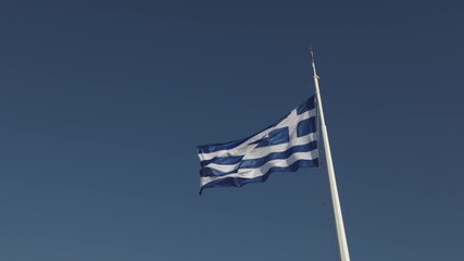 Flag of Greece waving, blue sky