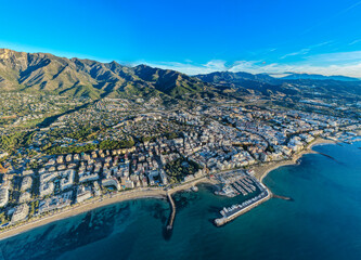 Luxury Living at Dawn: Cinematic 4K Aerial of Marbella&rsquo;s Golden Mile, Featuring Exclusive Beachfront Resorts, the Paseo Mar&iacute;timo, and La Concha Mountain, Costa del Sol, Spain