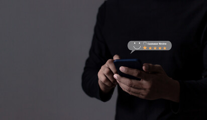 Review Customer, Young Man hand using smartphone mobile with five star to review and give 5 stars with very good results in service, Good review 5 star rating choice feedback