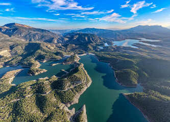 Cinematic Aerial 4K: Sweeping Wide-Angle Sunset Over Guadalhorce Lake, Pine Forests, and the Dramatic Caminito del Rey Gorge in Andalusia