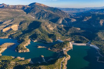 Cinematic Aerial 4K: Sweeping Wide-Angle Sunset Over Guadalhorce Lake, Pine Forests, and the Dramatic Caminito del Rey Gorge in Andalusia