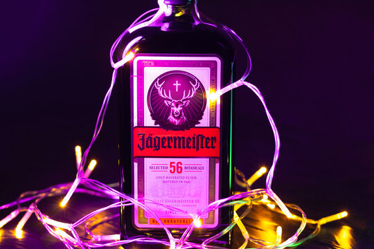 KYIV, UKRAINE - December 20, 2025 : Bottle of Jagermeister liquor drink in christmas lights and new year garlands.