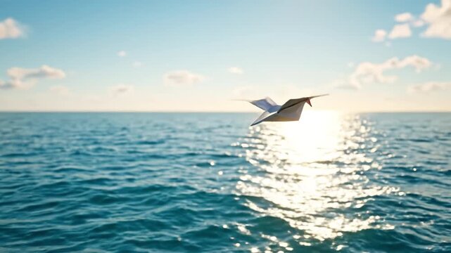 Paper seagull gliding above sunlit ocean surface golden hour with gentle waves and distant horizon evoking calm and freedom. paper crane flying over sparkling ocean sunset with soft sky and warm