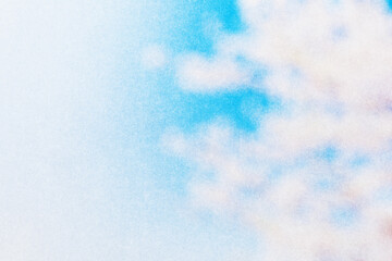 ざらざらの紙とぼやけた春の青空と桜の画像