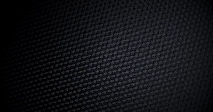 Carbon Texture Seamless Loop. Close-up of premium black carbon fiber weave with subtle light shift, creating a high-tech, endlessly background.