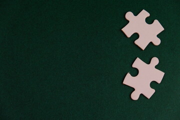 wooden puzzle on plain color paper with text space concept.