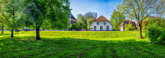 Panorama of a houses along Raadhuisdijk in Maasbommel, Netherlands