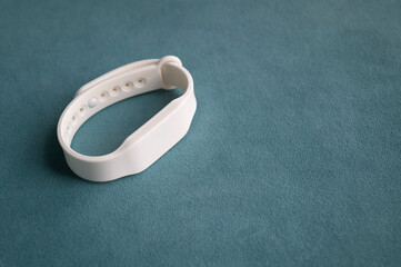 Waterproof access key bracelets with a microchip. Contactless white silicone access key. Functional gadget with an RFID bracelet.