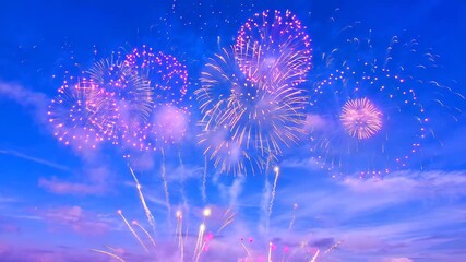 Spectacular display of pink and purple fireworks bursting against a deep blue sky - Powered by Adobe