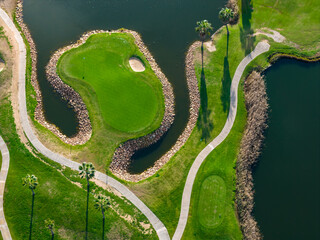 The Ultimate Retirement Dream: Cinematic Aerial Flyover of Salgados Golf Course Nestled Between the Atlantic Ocean and Natural Lagoons in Algarve, Portugal